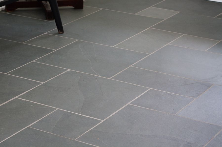 grey square natural stone tiles in a tessellated pattern